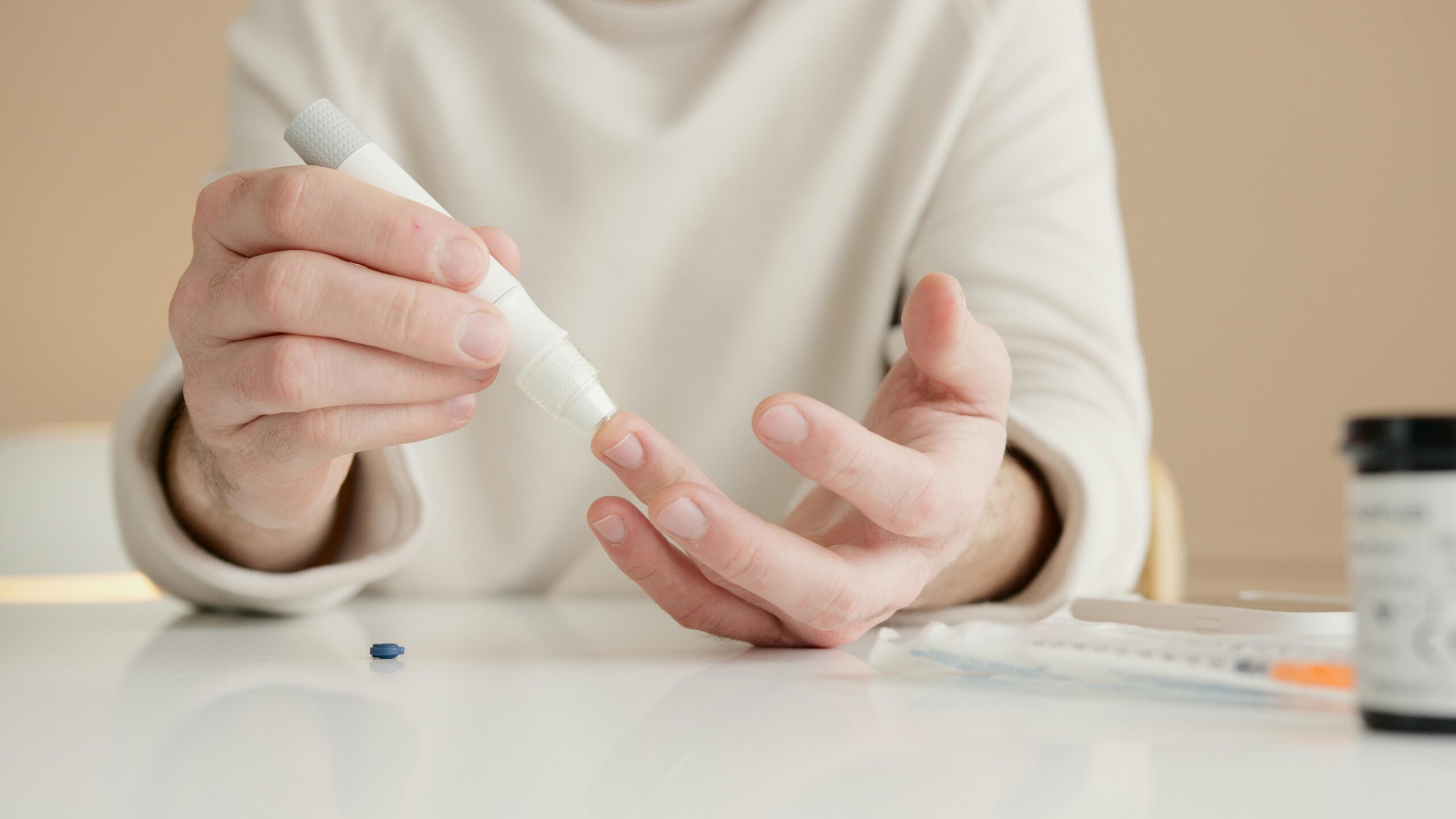 A person performing a fingertip blood test