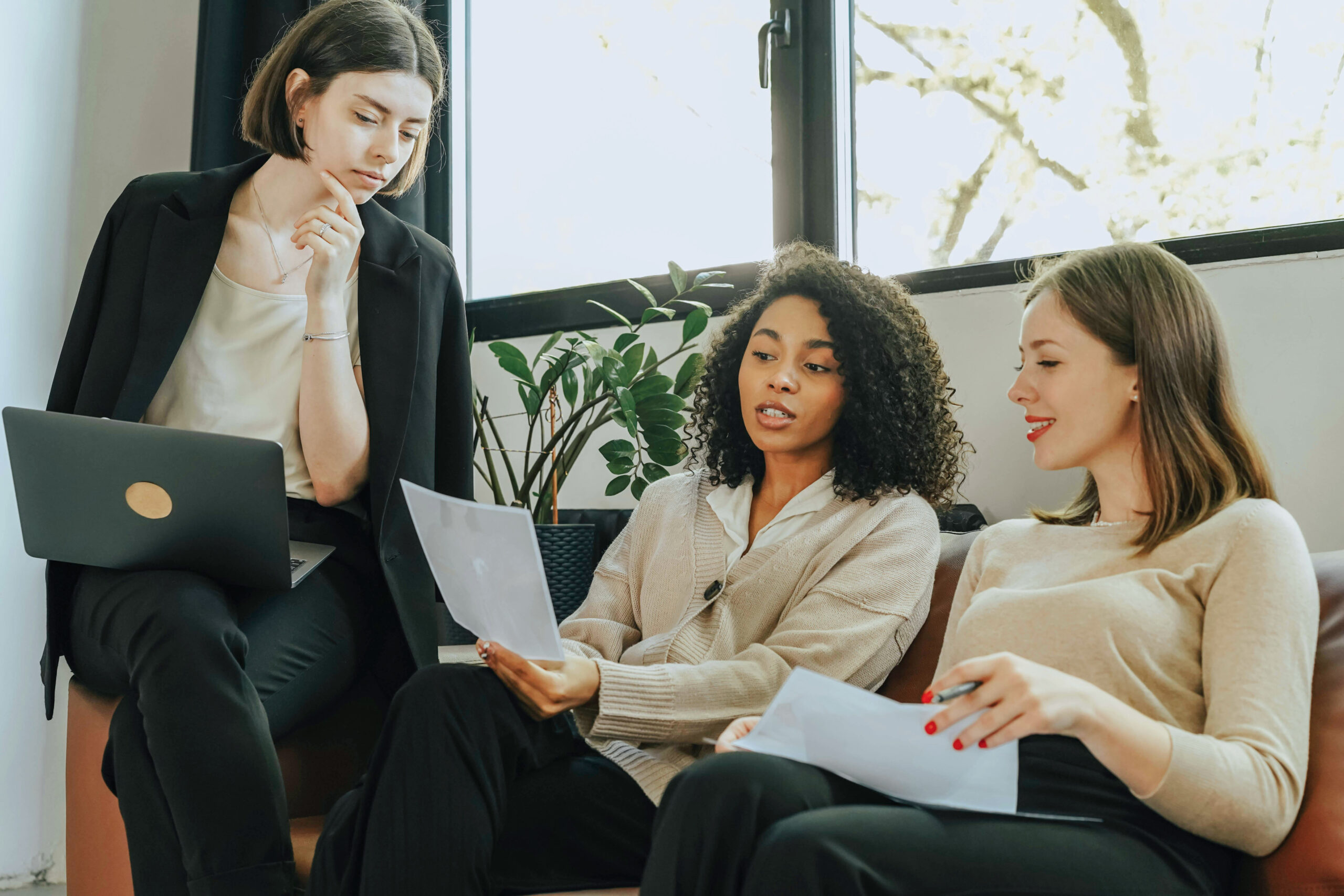 Three women working in an office Three women working in an office
